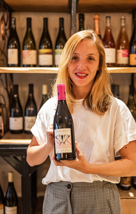 Marine with bottle of natural wine at Jeanne Antibes